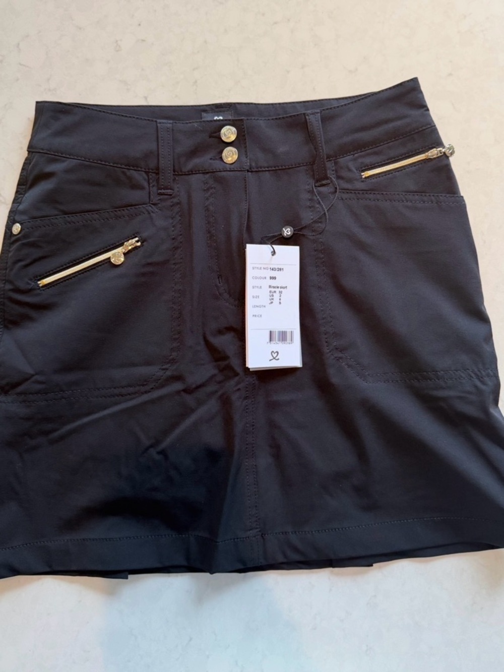 Daily Sports Black Skort with Gold Zipper Accents. NEW WITH TAG